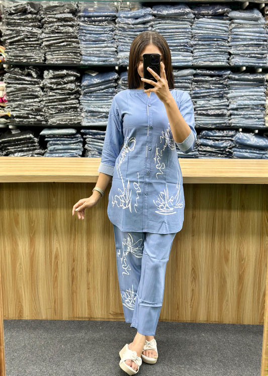 Vinayak Fashion blue cotton loungewear set with white prints worn by woman in store