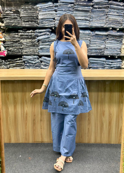 Woman wearing latest designer co-ord set in blue with printed patterns by Vinayak Fashion