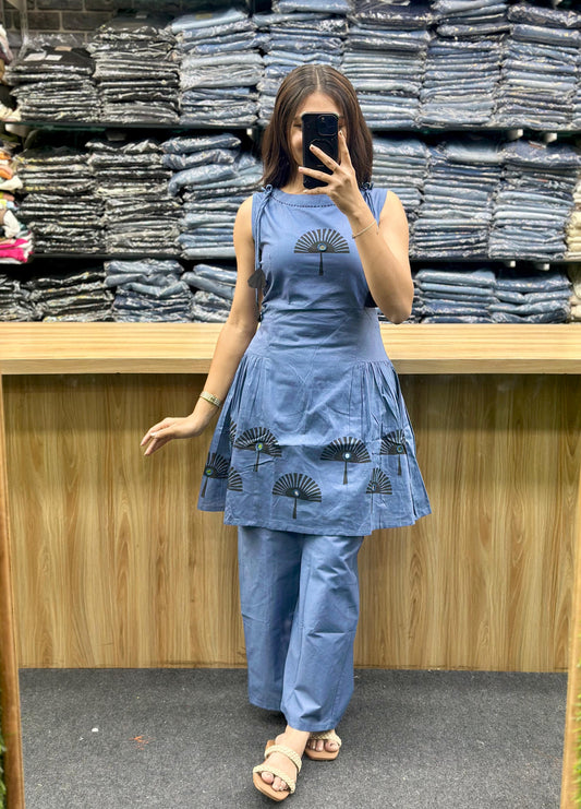 Woman wearing latest designer co-ord set in blue with printed patterns by Vinayak Fashion