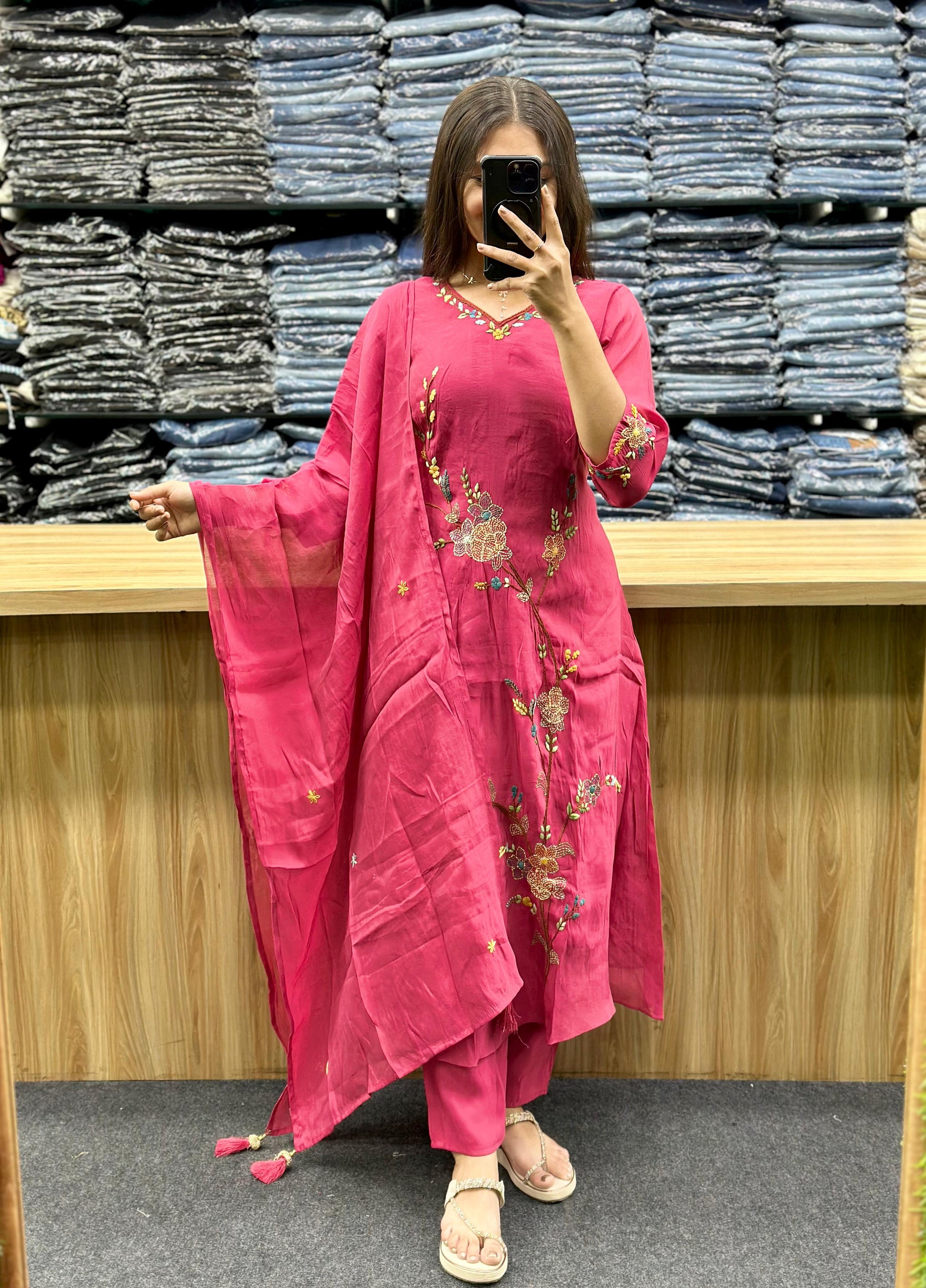 Woman wearing pink embroidered kurta set with matching dupatta and pants from Vinayak Fashion